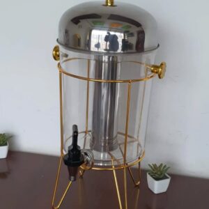 Golden metal frame juice dispenser