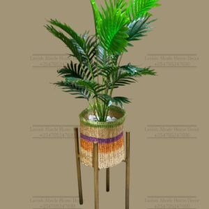 Artificial plant in a wooven sisal basket with (orange beige) and gold
metallic stand 110cm